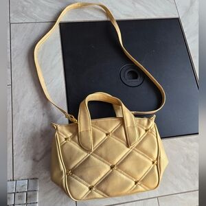 Objectives purse/ Crossbody. Cross patch with metal cross pattern on front.